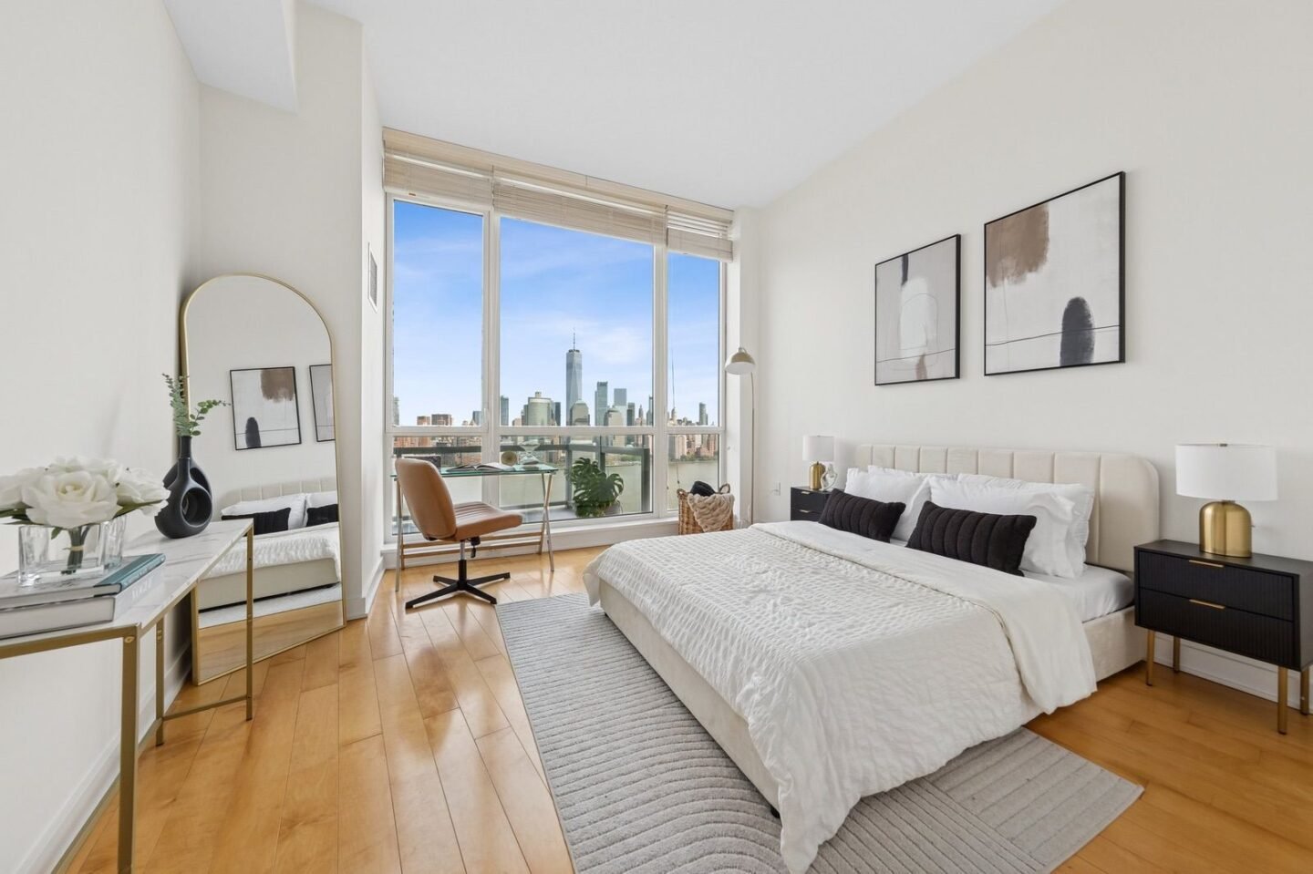 Bright furnished bedroom with a Manhattan skyline view